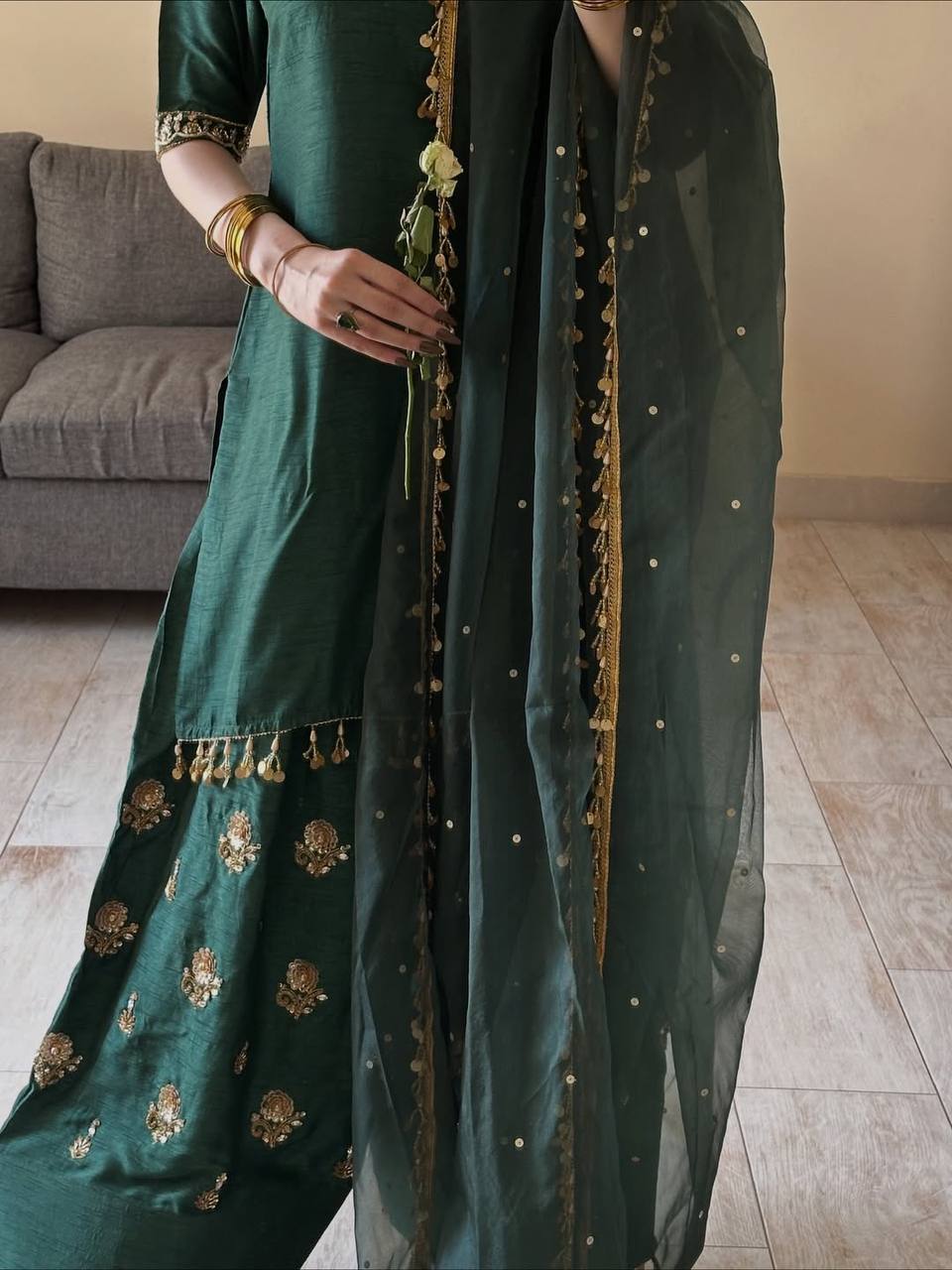 Majestic Emerald Green Kurta and Salwar Suit Set Featuring Intricate Gold Embroidery, Floral Motifs, and Ornate Coin Tassel Embellishments